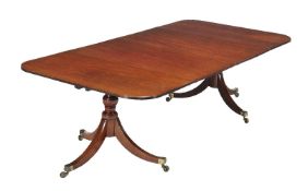 A mahogany twin pedestal dining table, circa 1825 and later, the pair of D-shaped ends with two