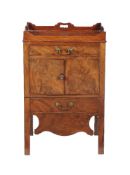A George III mahogany night commode, circa 1780, with frieze drawer above the cupboard doors, the