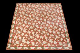 A machine woven carpet, probably first half 20th century, with an overall design of white lilies and