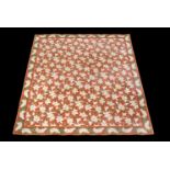 A machine woven carpet, probably first half 20th century, with an overall design of white lilies and