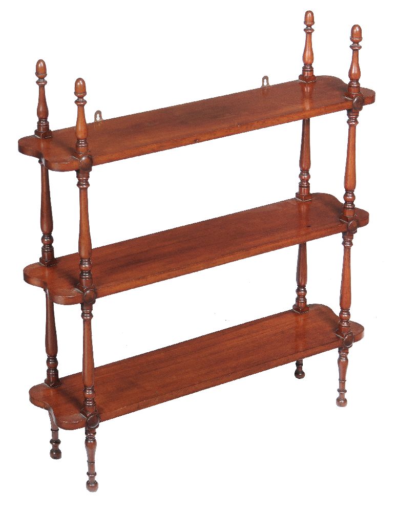 A flight of Victorian mahogany hanging wall shelves, mid 19th century, each shelf divided by