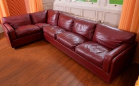 A maroon leather corner sofa by Poltrona Frau, of recent manufacture,, with removable seat