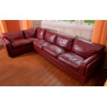 A maroon leather corner sofa by Poltrona Frau, of recent manufacture,, with removable seat