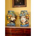 A pair of modern Sicilian Maiolica style figural head jars or planters, modelled wearing turbans,