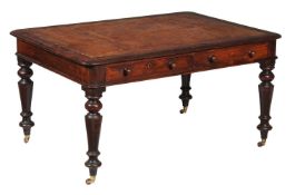 An early Victorian mahogany partner's desk, circa 1840, with a pairs of drawers to each of the two