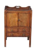 A George III mahogany tray top commode, circa 1780, with false drawer fronts to the slide now