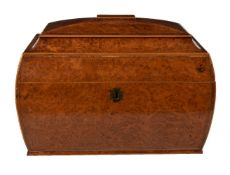 A substantial George IV amboyna tea caddy, circa 1825, of bombe sarcophagus form, the hinged