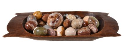 A collection of polished hardstone and marble models of eggs, including various onyx examples and