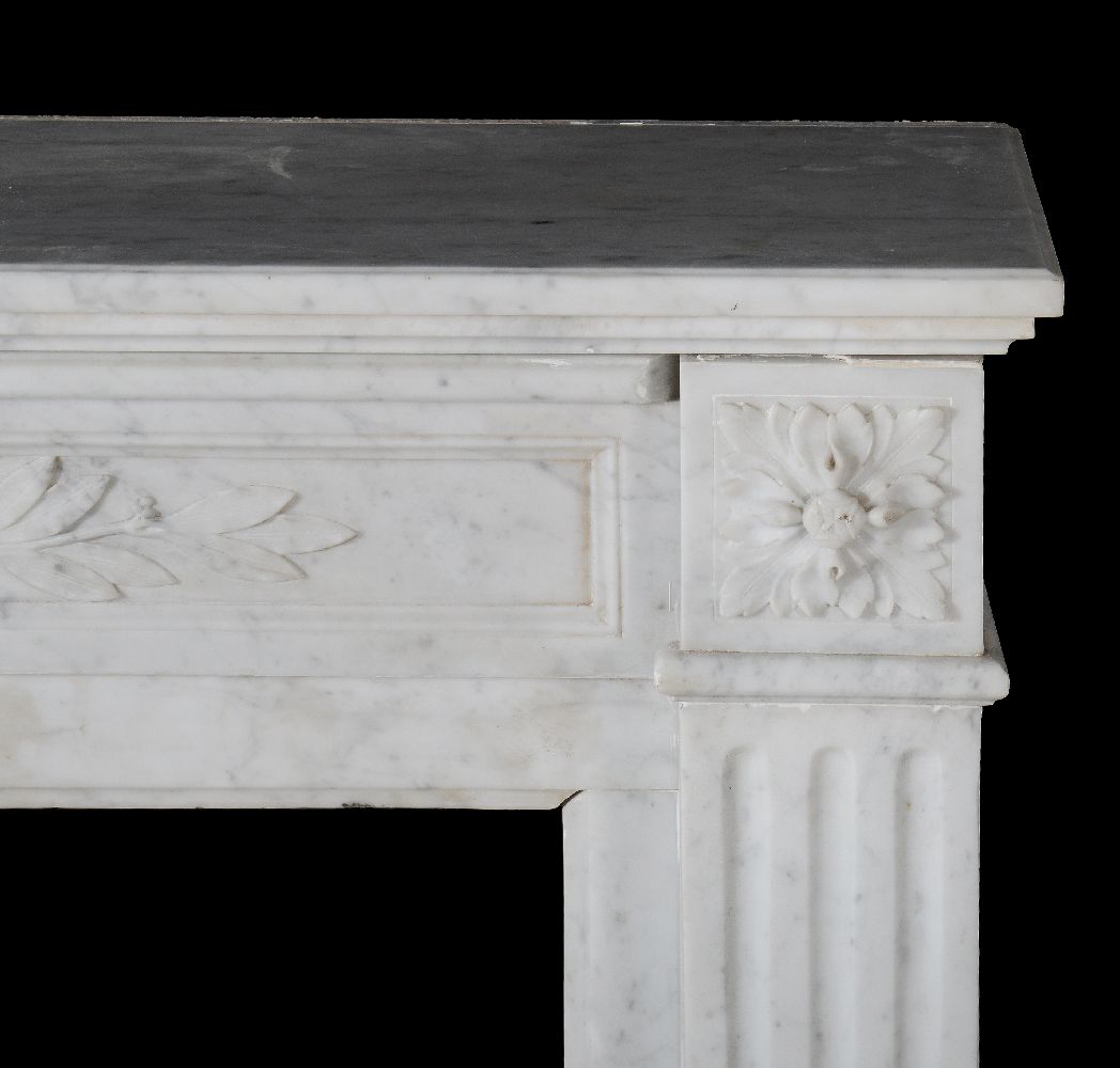 A mottled white marble chimneypiece in Louis XVI style, 19th century, the frieze of crossed laurel - Image 3 of 4
