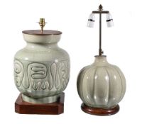 Two celadon glazed ceramic lamps, one of lobed form and the other of tapering cylindrical shape,