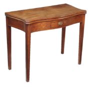 A George III mahogany folding tea table, circa 1780, of serpentine outline and with single frieze