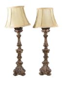 A pair of Italian carved and silvered wood altar sticks in Baroque style, late 18th century, the