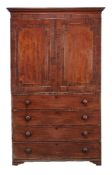 A George IV mahogany secretaire clothes press, circa 1825, in the manner of Gillows, the doors