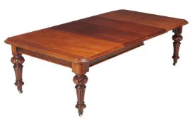 A Victorian mahogany extending dining table, circa 1860, the top incorporating two additional leaf