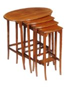 Y A nest of mahogany and rosewood banded quartetto tables, early 20th century, the largest oval
