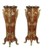 A pair of walnut veneered and gilt metal mounted torchere or vase stands in Louis XV style,