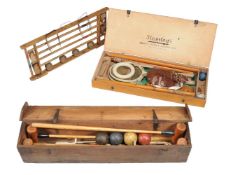 A Hamleys cased garden badminton set, 20th century, including net and racquets, A croquet set,