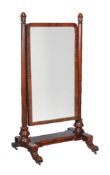 A William IV mahogany cheval mirror, circa 1835, the shaped rectangular plate supported by turned
