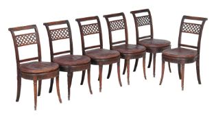 A set of twelve mahogany and cane seated dining chairs in Regency style, circa 1900, with bar back