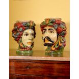 A pair of modern Sicilian Maiolica style figural head jars or planters, modelled wearing turbans,