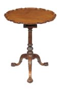 A George III mahogany piecrust tripod table, circa 1770, with birdcage action, the stem and legs
