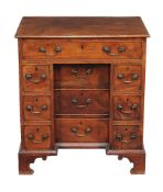 A mahogany kneehole desk in George III style, 19th century, of small proportion, fitted with an