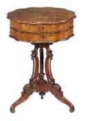 A French figured walnut work table, circa 1870, 73cm high, the shaped top 70cm diameter overall