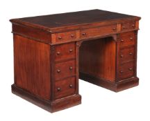 A Victorian mahogany twin pedestal desk, circa 1870, the top with inset writing surface above