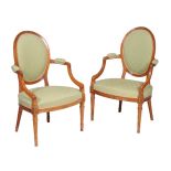 A pair of solid satinwood open armchairs in George III style, circa 1900, after the manner of John