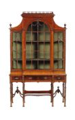 A mahogany cabinet on stand in 18th century style, late 19th/early 20th century, the glazed top with