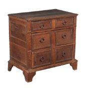 An oak chest of drawers, circa 1700, of small proportion, with three long drawers each with