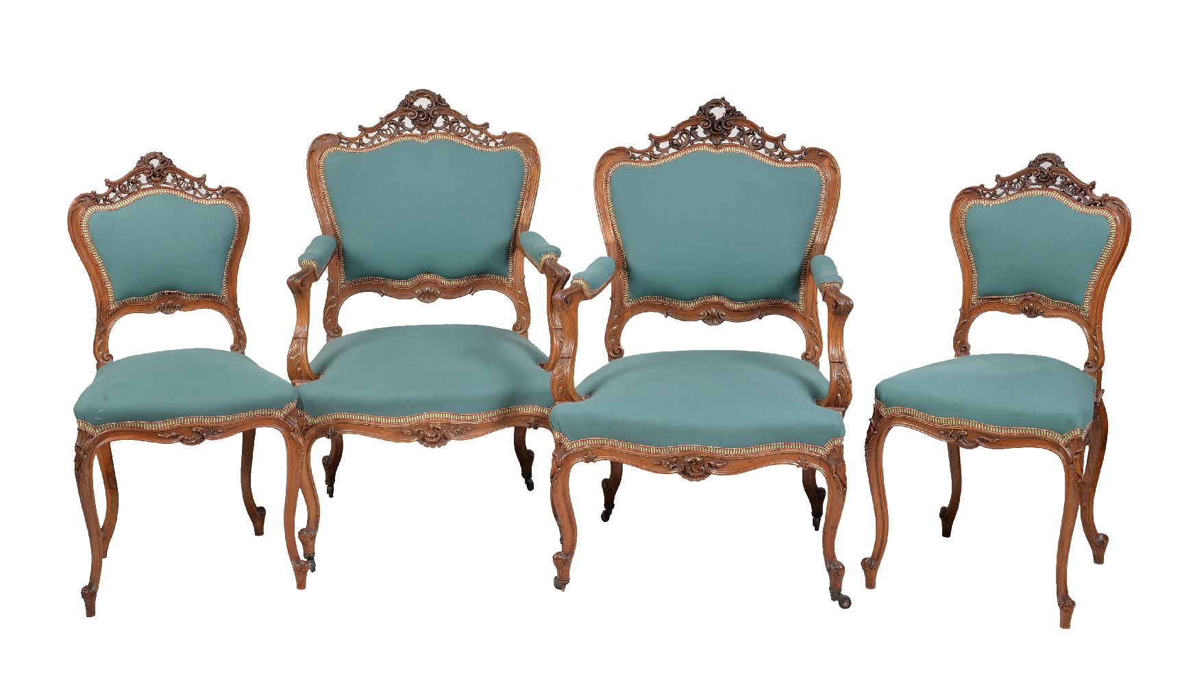 A set of four French carved walnut and upholstered salon chairs, comprising a pair of armchairs,