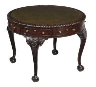A mahogany drum library table, late 19th century, after the manner of Vile & Cobb, the top with