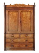 A Regency mahogany clothes press, circa 1815, probably Irish, Cork, the panelled cupboard doors