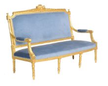 A carved giltwood settee in Louis XVI style, 20th century, 109cm high, 158cm wide, 74cm deep