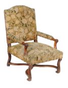 A walnut, beech and tapestry upholstered armchair, first half 18th century, 101cm high, 69cm wide,