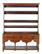 A George III Welsh oak potboard dresser base and rack, first half 18th century, probably South