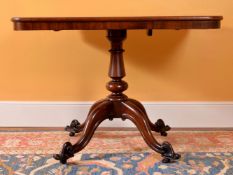 A Victorian mahogany rectangular centre table, mid-19th century, the tilt top above turned pillar