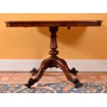 A Victorian mahogany rectangular centre table, mid-19th century, the tilt top above turned pillar