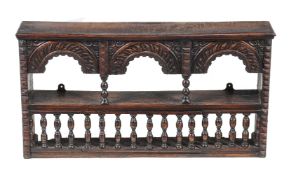 An oak wall rack in late 17th century style, possibly incorporating some period elements, 50cm high,