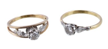 A diamond ring, the brilliant cut diamond in a claw setting, to foliate shoulders, stamped 18ct,