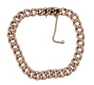 A gold coloured curb link bracelet, the polished links to a concealed clasp, stamped 15, 21.5cm