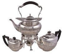 An Edwardian silver oval baluster kettle on stand by William Hutton & Sons Ltd., London 1902, the