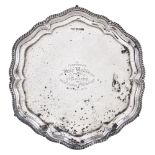 A silver shaped circular salver by Walker & Hall, Sheffield 1925, with a raised gadrooned rim, on