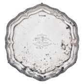 A silver shaped circular salver by Walker & Hall, Sheffield 1925, with a raised gadrooned rim, on