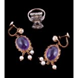 A pair of amethyst and cultured pearl earrings, the oval cabochon amethyst within a ropetwist