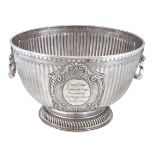 A late Victorian silver pedestal punch bowl by Daniel & John Wellby, London 1899, with twin mask and