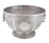 A late Victorian silver pedestal punch bowl by Daniel & John Wellby, London 1899, with twin mask and