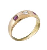 A Victorian 18 carat gold ruby and diamond ring, the central old cut diamond set between two