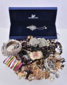 A collection of costume jewellery, including: various brooches; bracelets; and other items